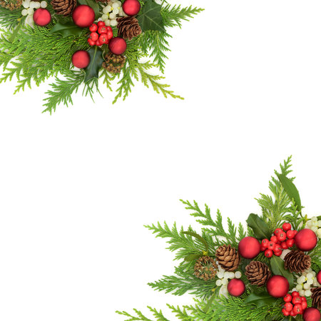 Christmas red bauble decorations, holly, mistletoe, fir, ivy flora, pine cone border frame on white background. Festive traditional nature Xmas design.の写真素材