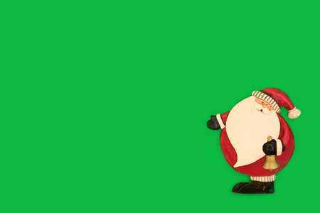 Retro Santa Claus tree bauble Christmas vintage decoration on green background. Magical  Xmas Eve symbol for the festive season. Greeting card, gift tag, copy space.の写真素材