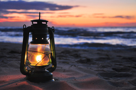 Oil lamp in the sunsetの写真素材