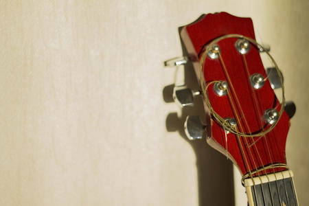 the strings on the guitar. musical instrument