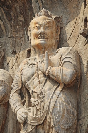 Buddha's statue rock carving in Longmen Grottoes at Yi River, Luoyang City, Henan province, Chinaの写真素材