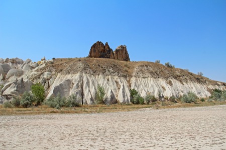 Natural valley with volcanic tuff stone rocks in Goreme in Cappadocia, Central Anatolia region of Turkey. Popular tourist destination in Turkey for trekking.の写真素材