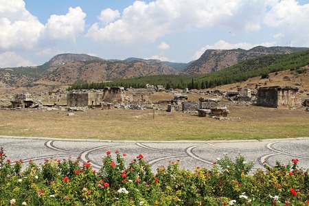 Beautiful view of the ruins of the ancient Hierapolis city next to the travertine pools of Pamukkale, Turkey. The famous tourist destination in Turkey.の写真素材