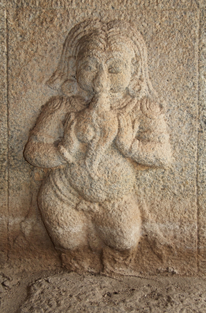 Stone bas-reliefs on Hindu temples. Prasanna Virupaksha temple is also known as the Underground Shiva Temple in Hampi, Karnataka, India.の写真素材