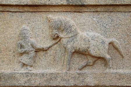 Hampi, Karnataka, India - October 20, 2017: Stone bas-reliefs on the walls around the Vittala Temple. Unesco World Heritage Site. The famous tourist destination from GOA.のeditorial素材
