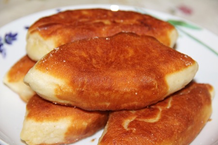 Traditional Russian or Ukrainian homemade pirozhki. Fried pies or patties, closeup.の写真素材
