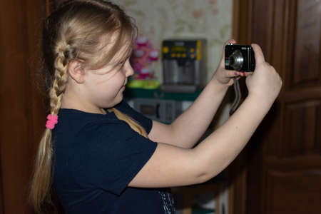 A girl learns to take pictures.