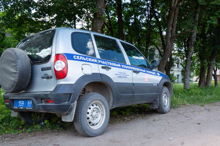Service car of the rural district police Commissioner Chevrolet Niva with a spare wheel on the back of the door.のeditorial素材