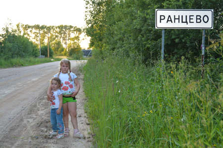 Girls walk down the street and enjoy the good weather.の写真素材
