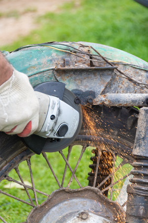 Repairs of an old motorcycle "Ural" in the summer in warm weather in the country.のeditorial素材