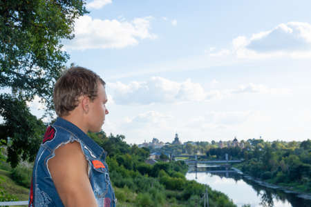 A teenager walks in the park of Love and Fidelity. Beautiful landscape. Historically restored park,...