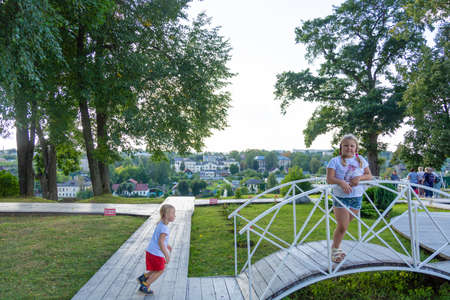 Children walk in the park "Love and Fidelity". Historically restored park, in the style of the 19th century, on the high bank of the Tvertsa River. Torzhok, Tver region, Russia.のeditorial素材