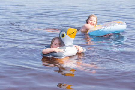 People frolic in the water on a hot, sunny summer day.