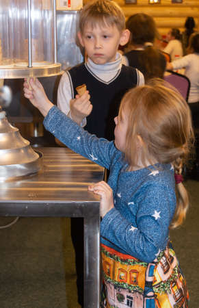 Children on an excursion to the Museum of the History of Milk and Glazed Cheese. Moscow region, Russia.のeditorial素材