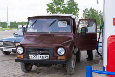 Old car at the gas station.