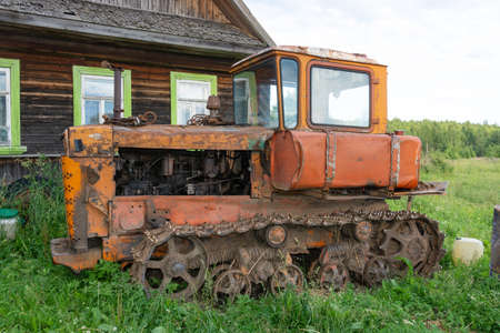 Old crawler tractor bulldozer. Bulldozer T-130 Tracked tractor platform T-130.