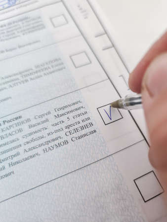 Russia, Moscow Region - September 17, 2021. Elections to the State Duma. Voting. The voting bulletin.のeditorial素材