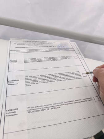 Russia, Moscow Region - September 17, 2021. Elections to the State Duma. Voting. The voting bulletin.のeditorial素材