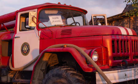 Fire service officers arrived at the scene. A fire truck at the scene of the fire. A fire in the village. Burning wooden houses in the village of Rantsevo, Tver region.のeditorial素材