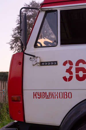 Fire service officers arrived at the scene. A fire truck at the scene of the fire. A fire in the village. Burning wooden houses in the village of Rantsevo, Tver region.のeditorial素材
