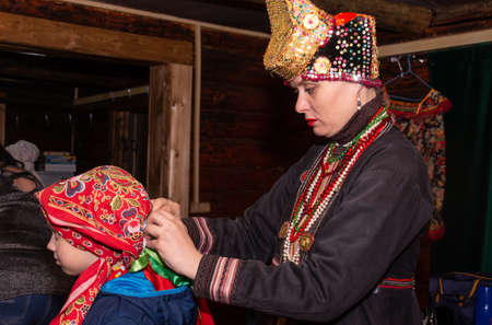 The Russian folk musical women's ensemble is preparing for a performance, trying on costumes.のeditorial素材
