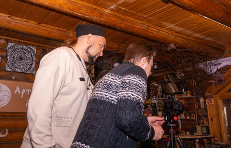 A videographer shoots a video on a video camera. The shooting process. The work of a videographer.