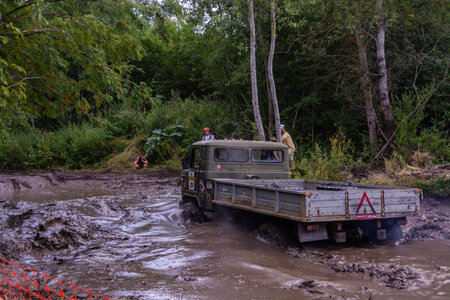 The car overcomes difficult obstacles. Large-scale sports competitions of off-road cars TVER...