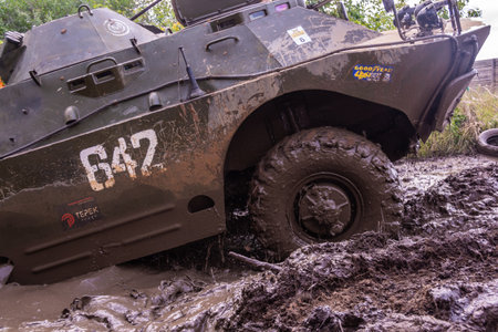 The car overcomes difficult obstacles. Large-scale sports competitions of off-road cars TVER...