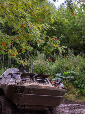 The car overcomes difficult obstacles. Large-scale sports competitions of off-road cars "TVER KNEADING: RACE OF TITANS" in the "Pavlov Adventure Park" in Tver. August 12, 2022.のeditorial素材