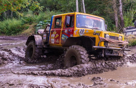 The car overcomes difficult obstacles. Large-scale sports competitions of off-road cars TVER...