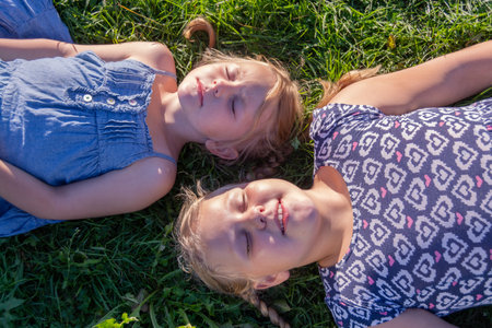 Portrait of girls, sisters, girlfriends. Happy, joyful children.の写真素材
