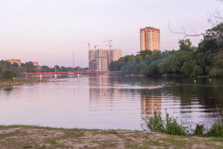 Landscape with river and high-rise buildings on the background.の写真素材