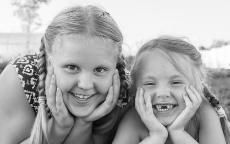 Sisters. Friends. Portrait. Beautiful elegant girls. Children are models.の写真素材