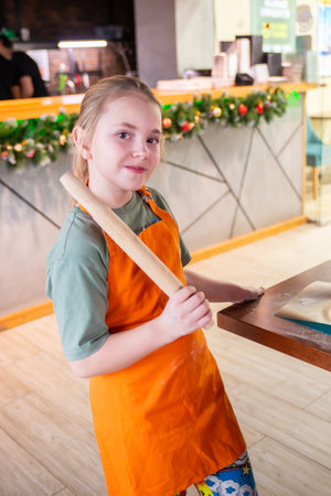 Russia Moscow region-12/29/2024. Girls at a pizza cooking class in a restaurantの写真素材