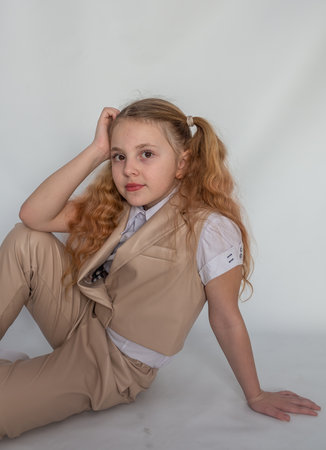 Portrait. Emotions. The girl is a model in a fashionable suit.