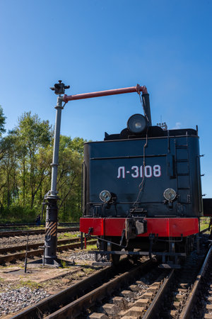 Ostashkov Tver region, Russia-08/25/2024. RETROPOEZD "SELIGER" on steam traction. The locomotive's tender is filled with water from a hydraulic columnの写真素材