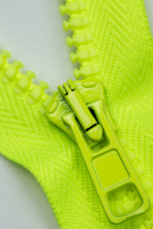 closeup of green zipper wit hpull tab