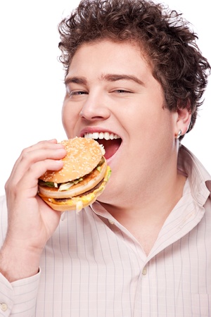 Cute chubby eating a hamburger, isolated on whiteの写真素材