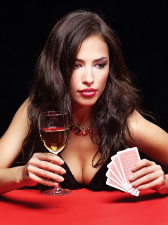 pretty young woman gambling on red tableの写真素材