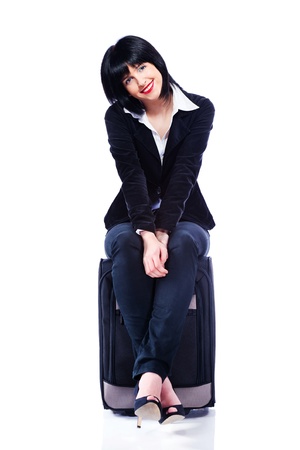 Young business woman and suitcase, isolated on whiteの写真素材