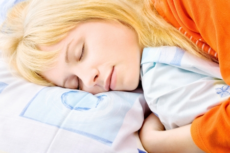 Blond girl sleeping, side close up lookの写真素材