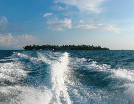 Over water bungalows and the blue sea and skyの写真素材