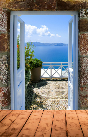 Beautiful sea view from the balcony. Oia town, Santorini island, Greece.の写真素材