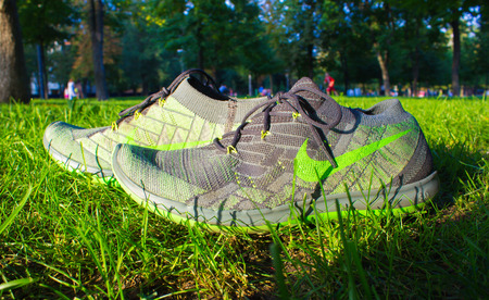 Dnipropetrovsk, Ukraine - August, 21 2016: New style nike shoes on green grass in park - illustrative editorialのeditorial素材