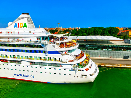 Venice, Italy - June 06, 2015: Cruise liner AIDA Vita docked at the port of Venice, Italy on a background of the roofs on June 06, 2015のeditorial素材