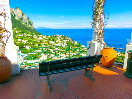 Capri island, Italy.Capri is an island in the Tyrrhenian Sea near Naples. View with wooden benche