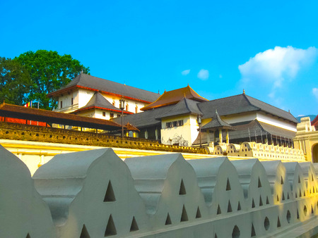 Kandy, Sri Lanka - May 02 2009: The people going to Temple Of The Sacred Tooth Relic, located in the Royal Palace Complex Of The Former Kingdom Of Kandy, Sri Lanka on May 02, 2009のeditorial素材
