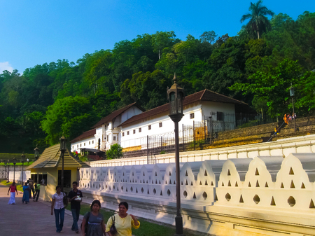 Kandy, Sri Lanka - May 02, 2009: The people going to Temple Of The Sacred Tooth Relic, located in the Royal Palace Complex Of The Former Kingdom Of Kandy, Sri Lanka on May 02, 2009のeditorial素材