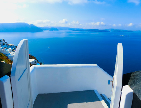 View to the sea from Oia the most beautiful village of Santorini island in Greeceの写真素材