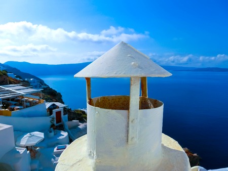 View to the sea from Oia the most beautiful village of Santorini island in Greeceの写真素材